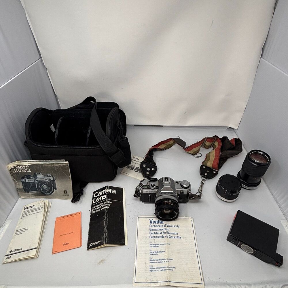 Canon AE-1 35mm SLR Film Camera W/ 2 Lens, Flash, Case, Paperwork UNTESTED